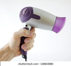 Man Holding Hair Dryer