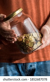 Man Holding Half Full Money Pot