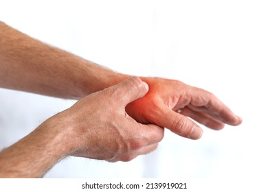 Man Holding Hand With Thumb Pain Problem Point Out Hurt Area With Red Gradient Color, Isolated On White With Copy Space For Text.