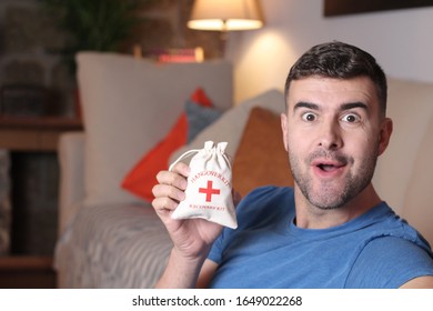 Man Holding A Hangover Kit 