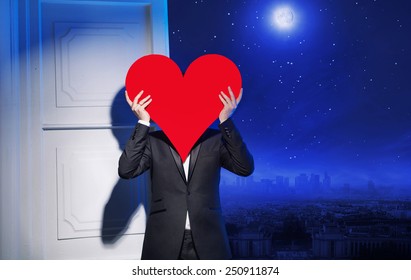 Man Holding Heart Symbol