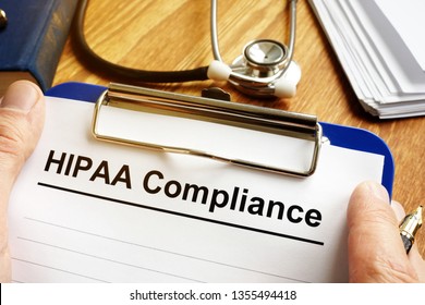 Man Is Holding HIPAA Compliance Application Form.