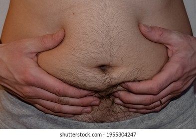 A Man Holding His Big Hairy Belly