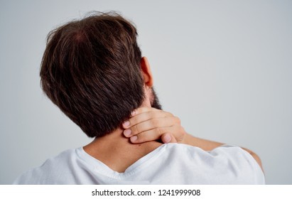 Man Holding His Neck Behind Stock Photo 1241999908 | Shutterstock