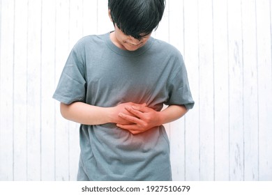 Man Holding His Stomach Because Of Liver Pain, Pancreas Or Kidneys Problems