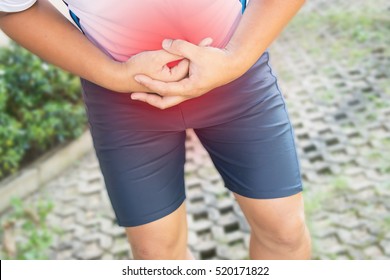 Man Holding His Stomach In Pain.