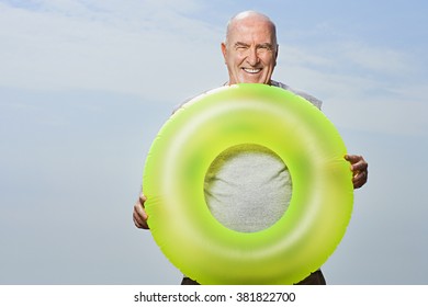 Man Holding An Inflatable Ring