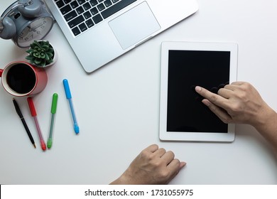 Man Holding Ipad With Blank Copy Space Screen For Your Text Message Or Your Content, A Man Use Smartphone At The White Desk