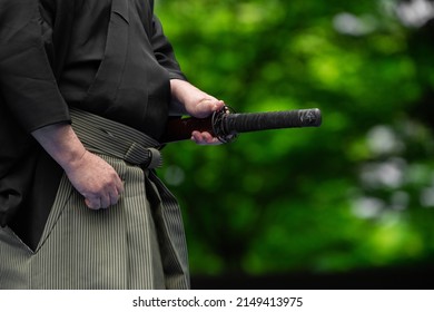 The man holding Japanese sword