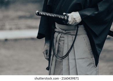 The man holding Japanese sword