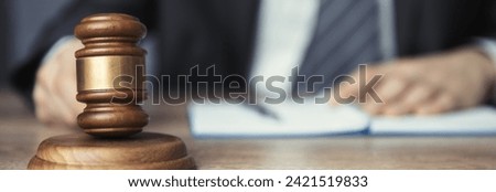 Man holding  judge with notepad

