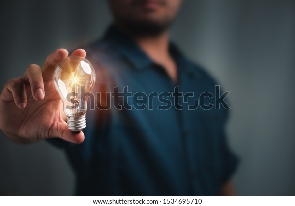 Man Holding Light Bulbs Ideas New Stock Photo (Edit Now) 1534695710