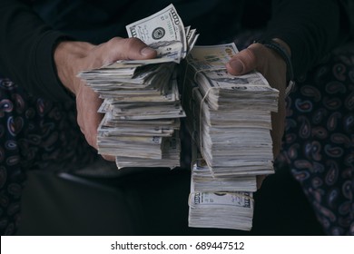 Man holding lots of money