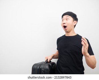 Man Holding Luggage Feeling Excited And Looking At Copy Space