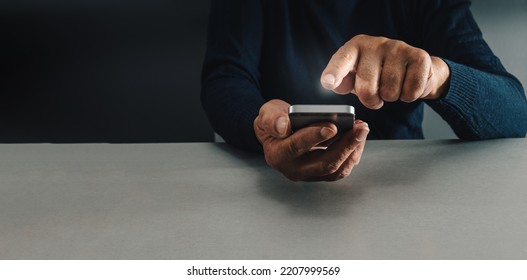 Man Holding Mobile Phone And Trying To Decide What To Buy Online ,concept Compulsive Buying Or Shopaholic