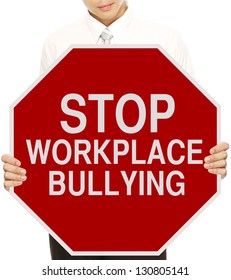 A Man Holding A Modified Stop Sign On Workplace Bullying