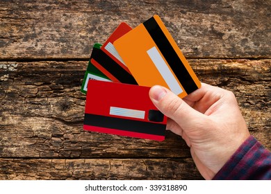 Man Holding Multiple Credit Cards