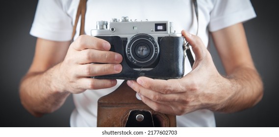 Man Holding Old Retro Camera.