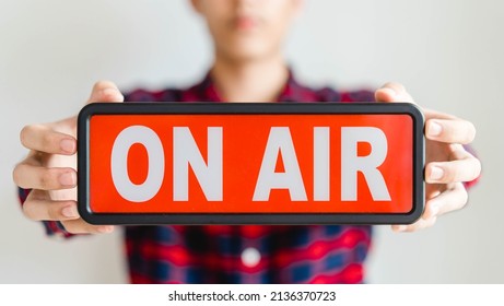 Man Holding On Air Red Box Sign In Studio For Record Live Streaming Media Broadcast Video On Social Network.Digital Online Entertainment Communication News, Radio Channel.Webinar, Story, Sport, Event.