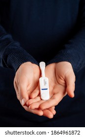 Man Holding Oral HIV Test On Blue Background. 