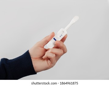 Man Holding Oral HIV Test On Blue Background. 