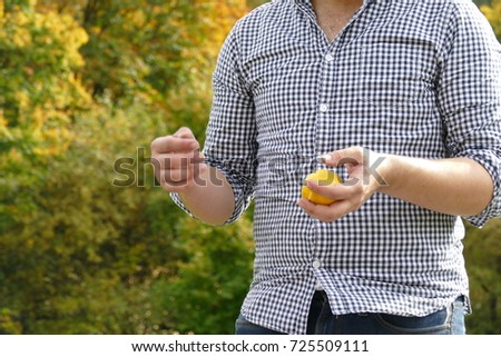 Similar – young latin man typing on his phone with emoji emoticons.