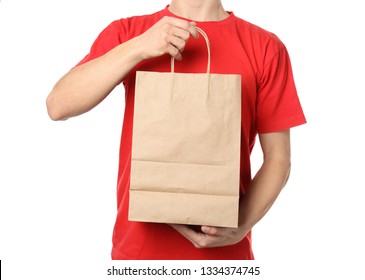 Man Holding Paper Bag On White Background. Food Delivery Service