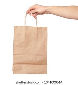 Man Holding Paper Bag On White Background. Food Delivery Service