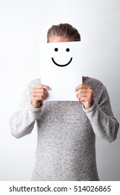 Man Holding A Paper Drawn With A Happy Face