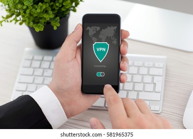 man holding phone with app vpn creation Internet protocols for protection private network