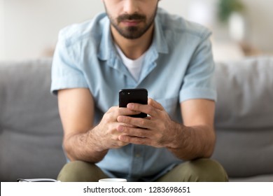 Man Holding Phone In Hands Texting Message Or Using Mobile Apps, Checking Social Media Applications On New Black Smartphone, Working Playing Game On Cellphone, Male Customer And Gadget Close Up View