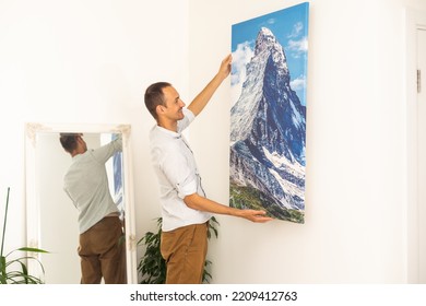 A Man Is Holding A Photo Canvas