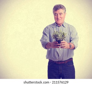 Man Holding A Plant