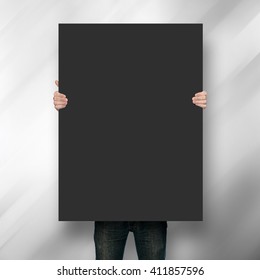 Man Holding Poster Mockup