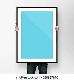  Man Holding Poster Mockup Template With Frame On White Backgrou