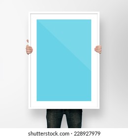 Man Holding Poster Mockup Template With Frame On White Backgroun