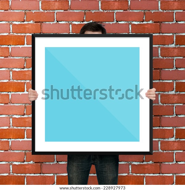 Man Holding Poster Mockup Template Frame Stock Photo Edit Now 228927973