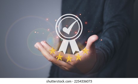 Man holding quality assurance, Guarantee, Standards, ISO certification and standardization. Quality management control. conformity to international standards. - Shutterstock ID 2254336073