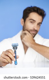 Man Holding Razor In Studio