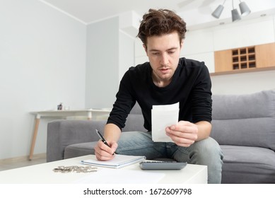 Man Holding Receipt, Making Financial Revision. Home Budget Concept.