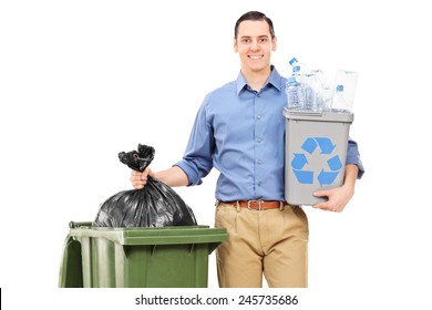 Man holding a recycle bin by a trash can isolated on white background