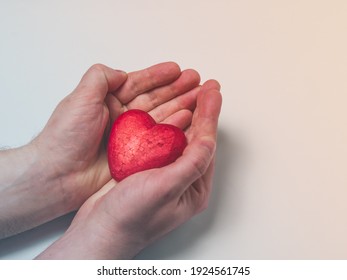 Man Holding A Red Heart, Health Insurance, Donation Charity Concept, World Health Day, World Heart Day, Heart Care, All Lives Matter Concept