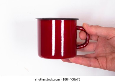 Man Holding Red Mug Isolated On White