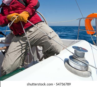 Man Holding Rope On Sailing Boat