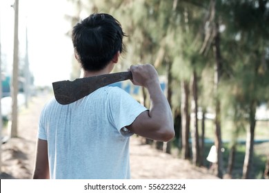 Man Holding Rusty Machete.