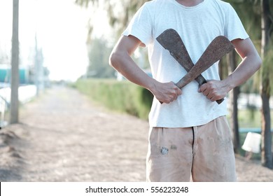 Man Holding Rusty Machete.