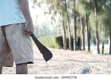 Man Holding Rusty Machete.