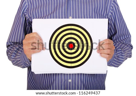 man is holding sheet of paper with a target drawn on it
