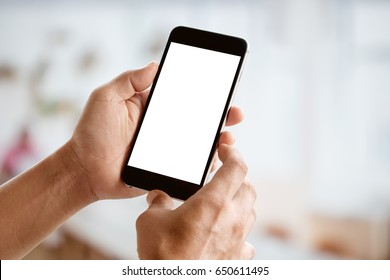 Man holding smart phone with blurred backgroung. Blank screen for Graphic display montage.  - Powered by Shutterstock