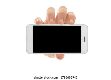 Man holding a smartphone with empty black screen. Mobile phone in a vertical position in hands and isolated on white background. High quality studio shot. Man shows the phone screen to the camera.